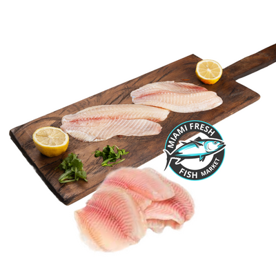 Tilapia-Fish-multi-fillets-on-brown-wood-plat-miami-fresh-fish-market