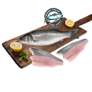 Branzino-Mediterranean-whole-Fish-fillets-lime-on-brown-wood-plate-Miami-fresh-Fish-Market