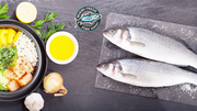 two-branzino-fish-with onion-limon-on-plate-miami-fresh-fish-marker
