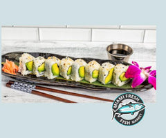 Sushi-Roll-Avocado-sauce-Chopsticks-on-black-plate-miami-beach