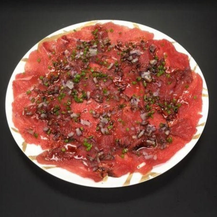 Tuna-Carpaccio-thinly-sliced-raw-platter-on-white-plate-miami-fresh-fish-market